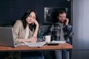 a couple showing financial stress and considering pre-settlement funding