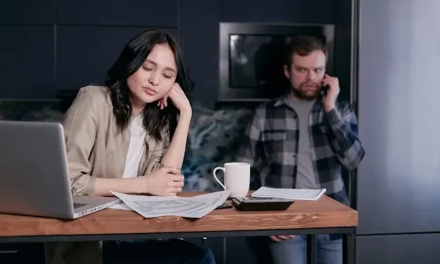 a couple showing financial stress and considering pre-settlement funding