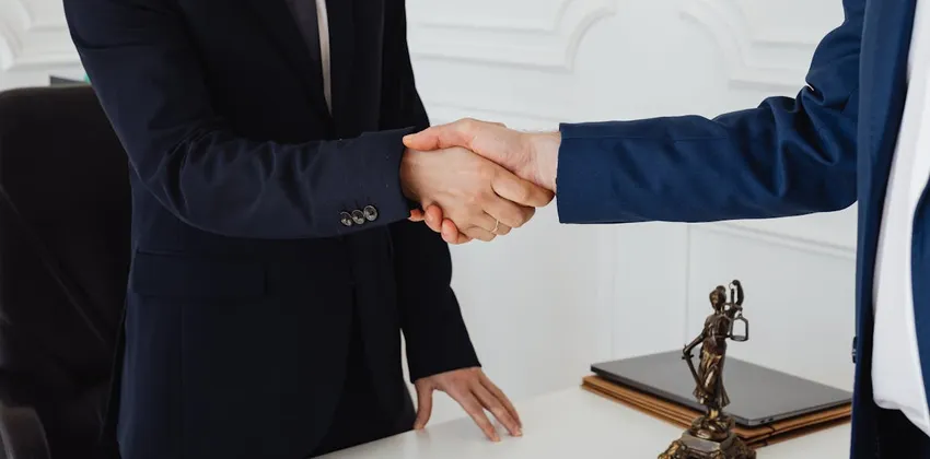a handshake to demonstrate a legal funding broker referral agreement