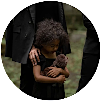 a young girl at a funeral from a wrongful death